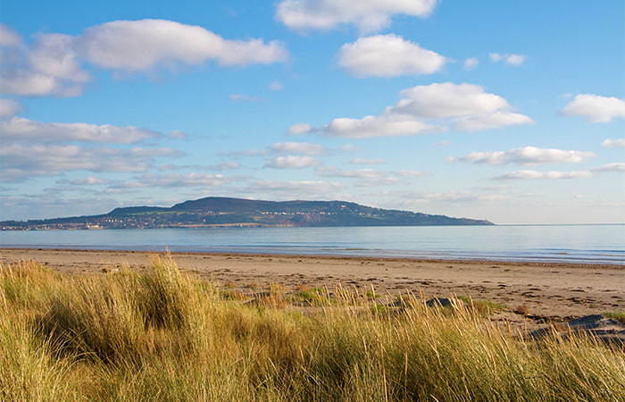 View of Dollymount Strand beach in County Dublin, Ireland
