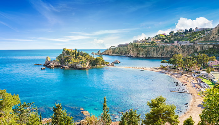 Aerial shot of Isola Bella Island and beach in Taormina, Sicily, Italy