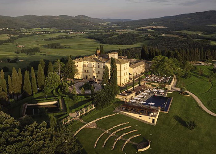 Aerial shot over Castello di Casole, A Belmond Hotel, Tuscany, Italy