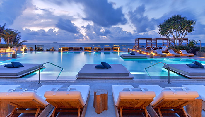 Evening on the rooftop pool at 1 Hotel South Beach, Miami, Florida