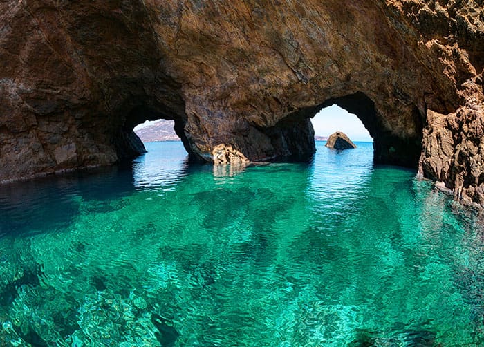 Tragonisi Island Caverns in Mykonos, Greece