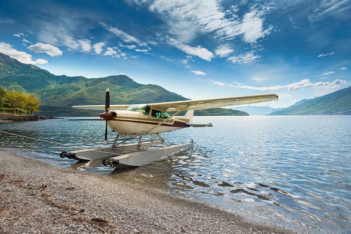 Float plane moored at a beach on Lake Como