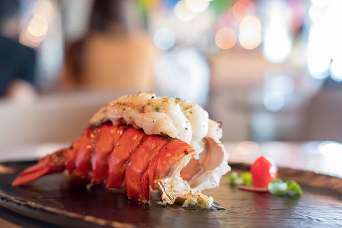 Close up of lobster meat protruding from shell