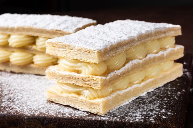 Cream-filled pastry dusted with icing sugar