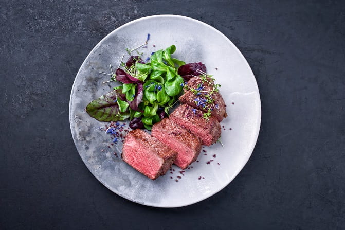 Wagyu beef dish with salad