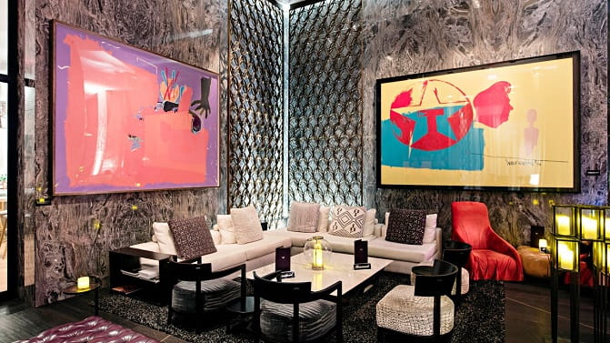 Lounge area with framed artwork on the walls at the W South Beach hotel in Miami.